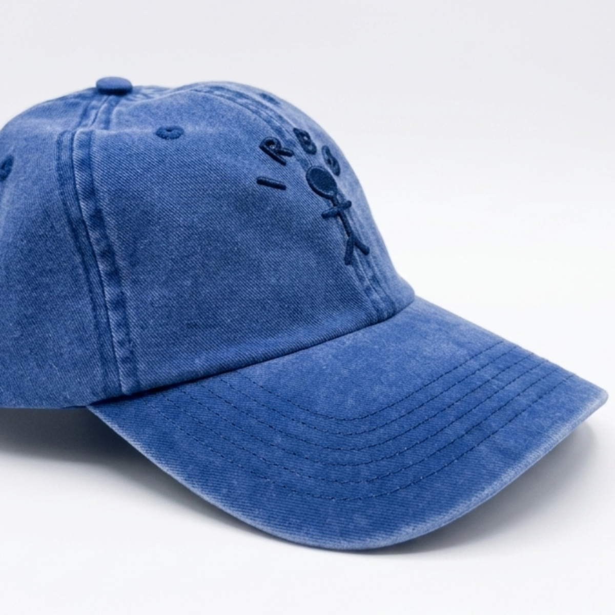 IRBN Cap in Marina Blue — stone wash cotton with 3D embroidered figure mark
