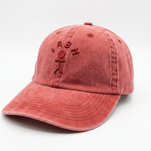 IRBN Cap in Lava Falls red — unstructured dad cap profile, adjustable strap at back