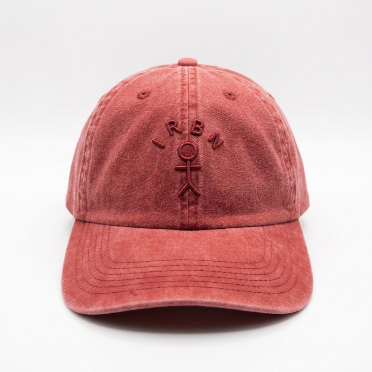 IRBN Cap in Lava Falls red — stone wash cotton with 3D embroidered figure mark at front