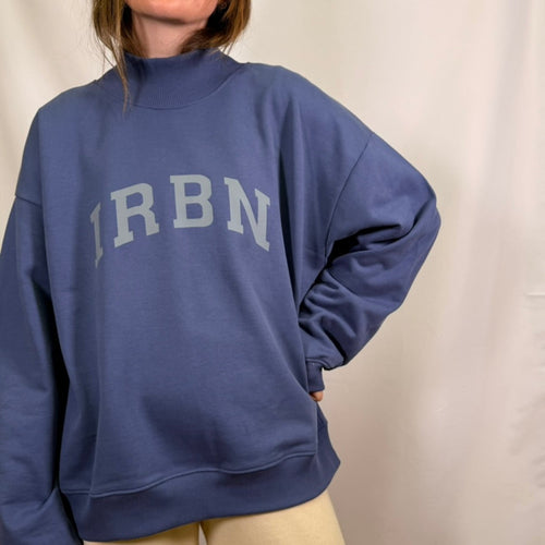 IRBN mock neck sweatshirt in Blue Indigo, front view showing IRBN arched chest print and relaxed oversized fit, 400gsm organic cotton