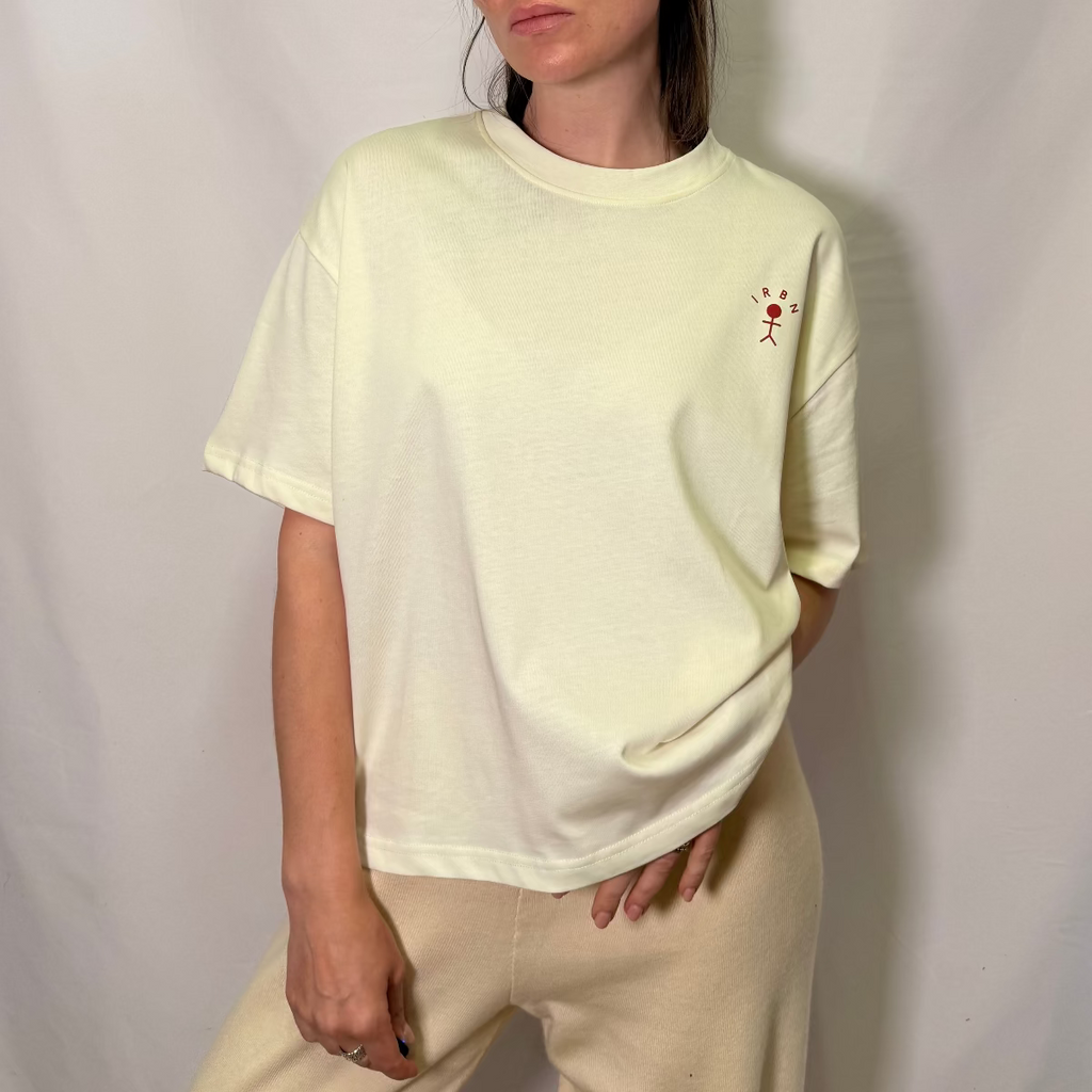 IRBN boxy t-shirt in Cannoli Cream, front full length view showing embroidered IRBN stick figure logo and relaxed oversized fit, 250gsm organic cotton