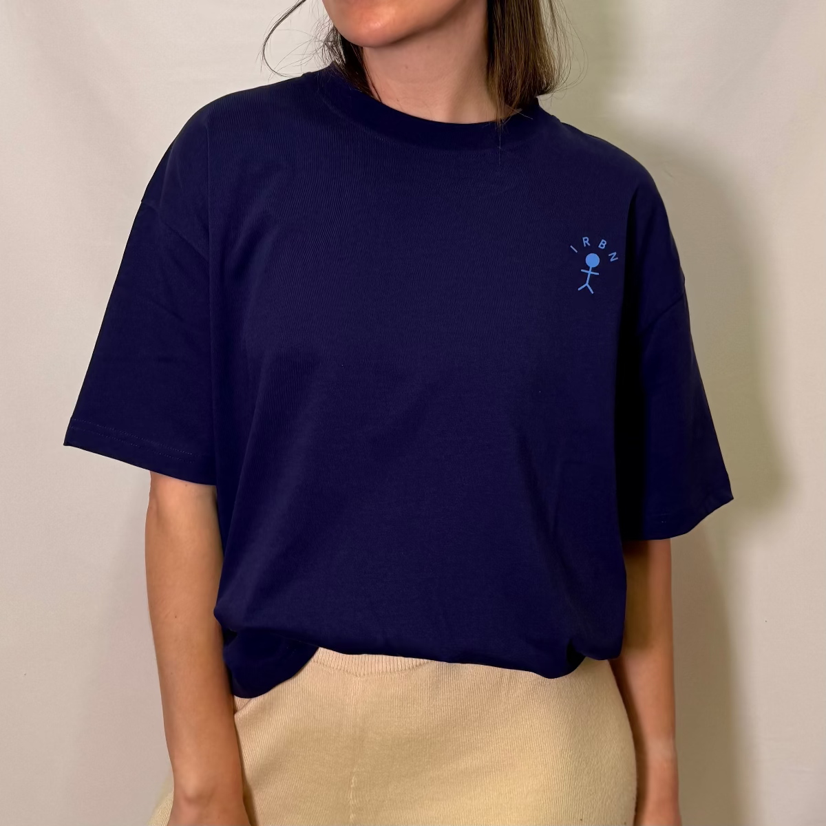 IRBN boxy t-shirt in Navy, front view showing embroidered IRBN stick figure logo on chest, 250gsm organic cotton